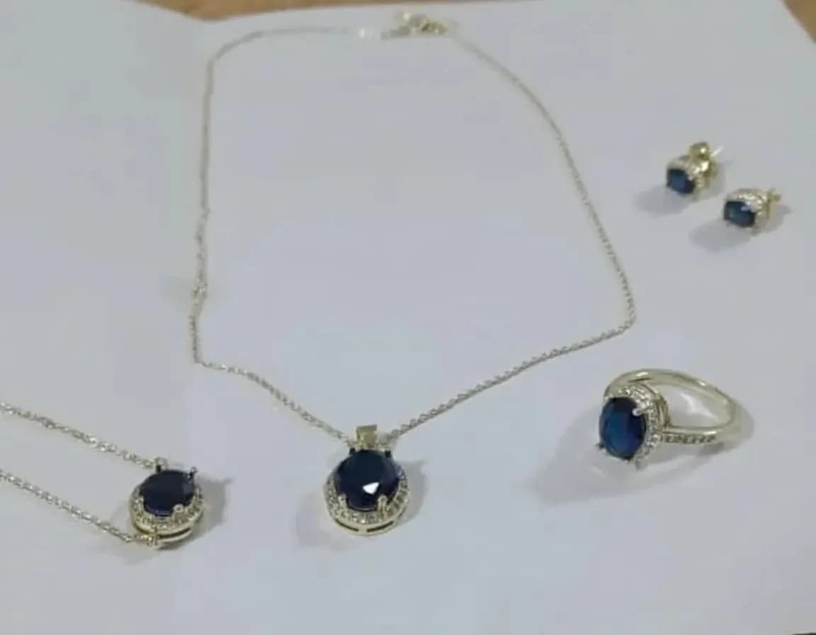 4-piece jewelry set features a striking dark blue stone