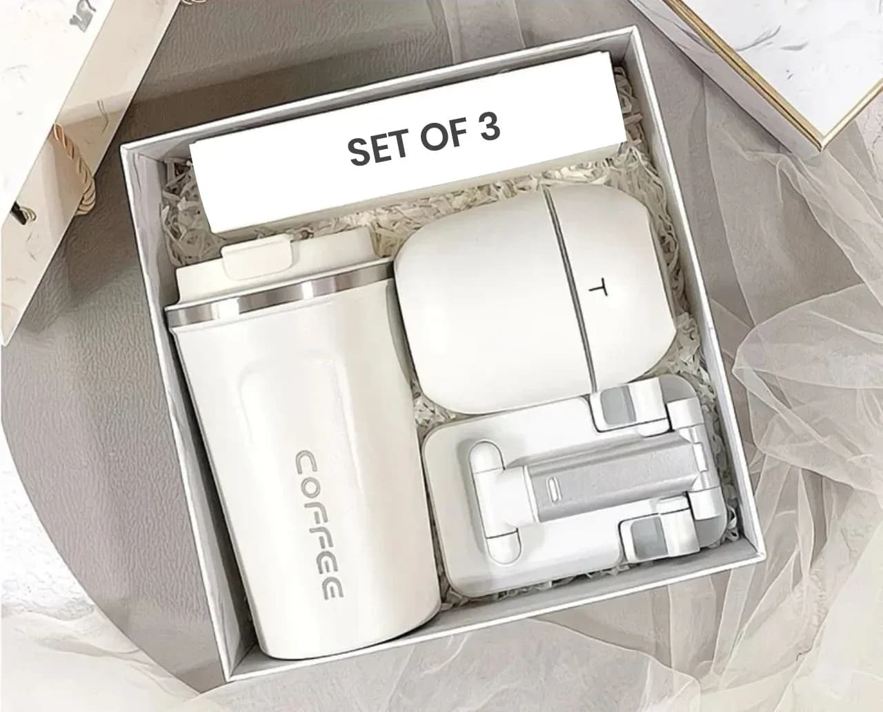 A stylish all-in-one gift set a coffee mug, a 3-in-1 mini humidifier and a foldable phone stand.